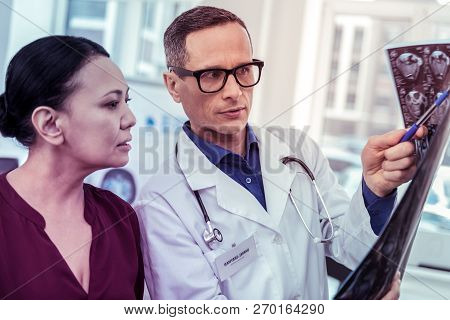 Serious Asian Woman Being In All Ears