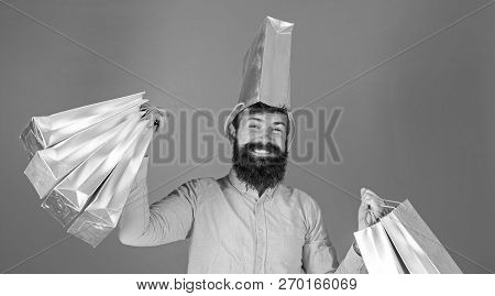 Man With Trendy Beard And Smiling Face Isolated On Blue Background. Hipster In Pink Shirt Doing Shop