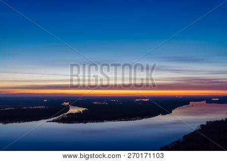 Beautiful River With Big Island With Trees Under Predawn Sky. Bright Yellow Stripe In Picturesque Cl