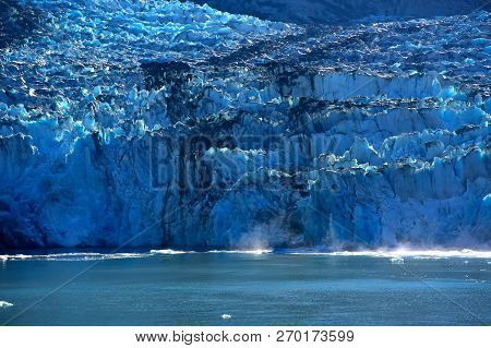 Ice Calving Off The Sawyer Glacier In The Tracy Arm Fjord, Alaska