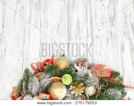 Christmas Winter Background- Christmas Wreath Close-up On A Wooden White Background. A Beautiful Ide
