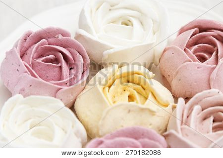 Multicolored Delicate Zephyr On A White Plate. Beautiful And Delicious Low Calorie Dessert. Creative