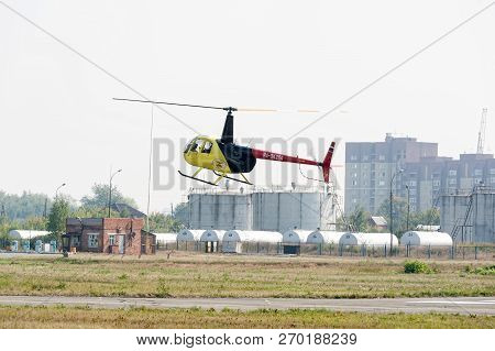 Tyumen, Russia - August 11, 2012: On A Visit At Utair Airshow In Heliport Plehanovo. Pilot Of Robins