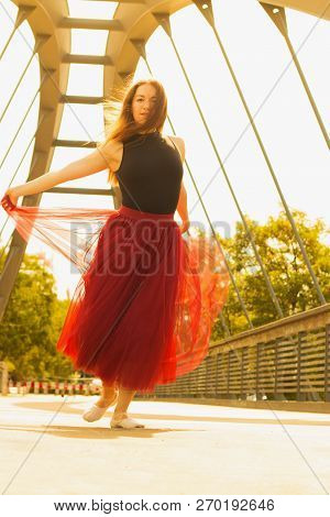 Young Slim Woman With Long Brown Hair Dancing