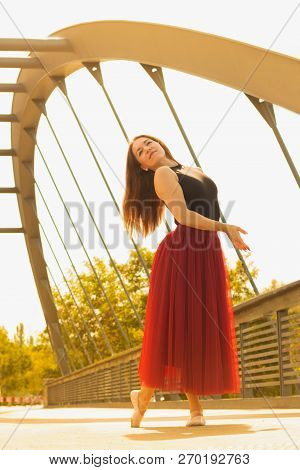 Young Slim Woman With Long Brown Hair Dancing