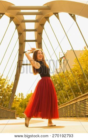 Young Slim Woman With Long Brown Hair Dancing