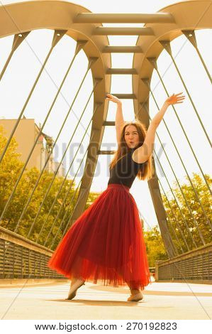 Young Slim Woman With Long Brown Hair Dancing
