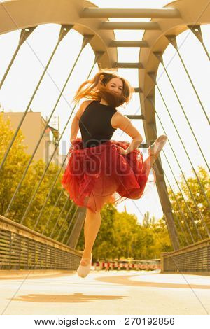 Young Slim Woman With Long Brown Hair Dancing