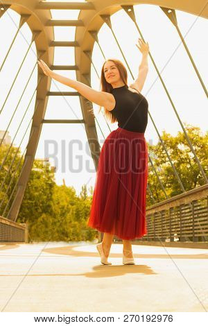 Young Slim Woman With Long Brown Hair Dancing
