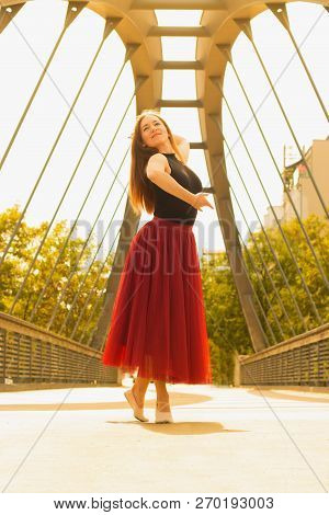 Young Slim Woman With Long Brown Hair Dancing