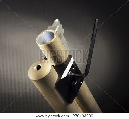 Hex Key Tightening A Weaponlight Base To A Shotgun