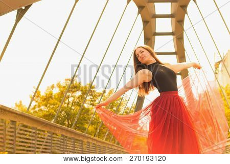 Young Slim Woman With Long Brown Hair Dancing