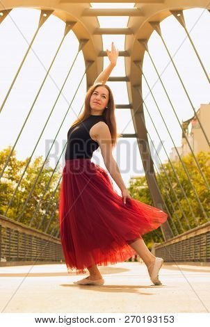 Young Slim Woman With Long Brown Hair Dancing