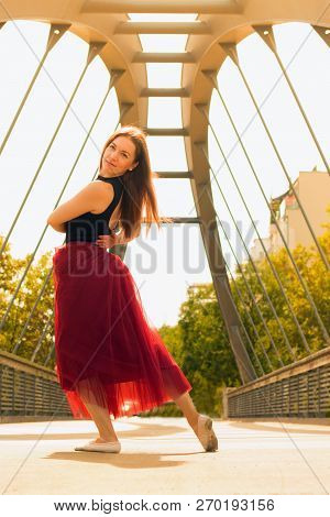 Young Slim Woman With Long Brown Hair Dancing
