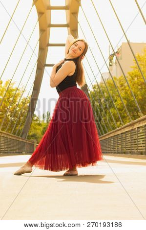 Young Slim Woman With Long Brown Hair Dancing