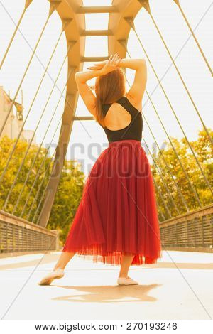Young Slim Woman With Long Brown Hair Dancing