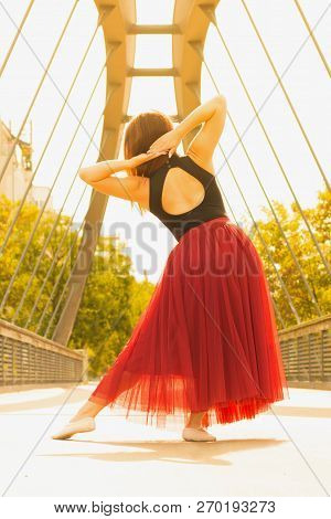 Young Slim Woman With Long Brown Hair Dancing