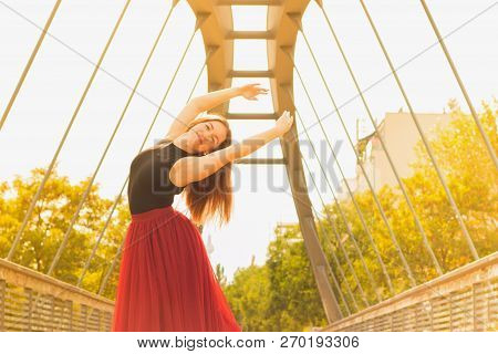 Young Slim Woman With Long Brown Hair Dancing