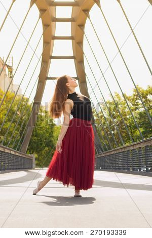 Young Slim Woman With Long Brown Hair Dancing