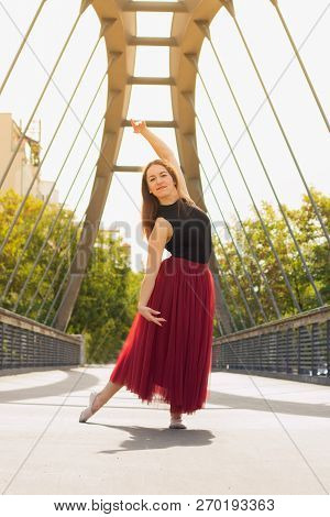 Young Slim Woman With Long Brown Hair Dancing