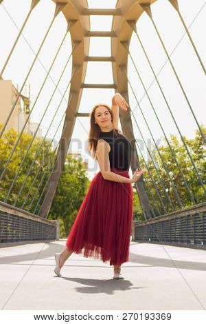 Young Slim Woman With Long Brown Hair Dancing