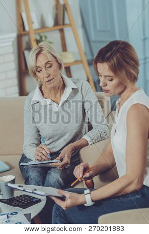 Business Woman Checking Data With Her Financial Advisor