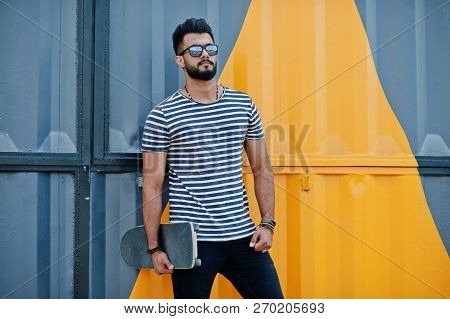 Handsome Tall Arabian Beard Man Model At Stripped Shirt Posed Outdoor. Fashionable Arab Guy At Sungl