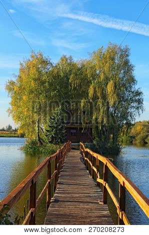 Rural Landscape Of Old Abandoned House In The Middle Of The Lake. Autumn Morning Landscape. Village 
