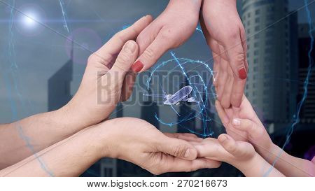 Mens, Womens And Childrens Hands Show A Hologram 3d Plane
