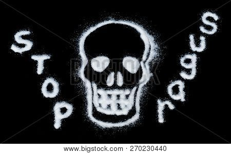 The Sweet Danger Of Sugar. Harm White Sugar Concept Forming A Skull. Isolated On A Black Background.