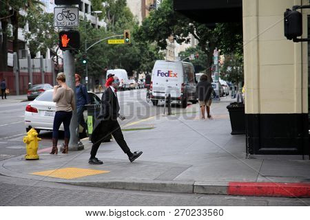Los Angeles California, 11/19/2018: A clown walks down the sidewalks of Los Angeles California. Editorial Use only.