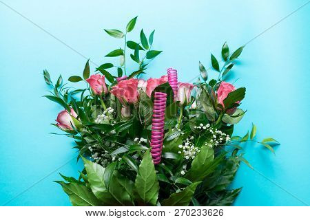 A Decorated Bouquet Of Pink Roses. Flowers On A Cyan Background. Stock Image.