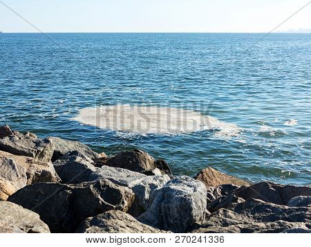 Full Frame Take Of Some Extremely Polluted Waters. Dirty Sea Water. Dirt On Water. Dirty Oil Spots O