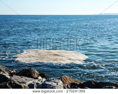Full Frame Take Of Some Extremely Polluted Waters. Dirty Sea Water. Dirt On Water. Dirty Oil Spots O