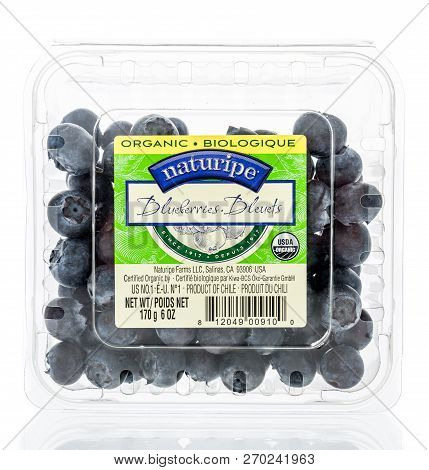 Winneconne, Wi - 21 November 2018: A Package Of Naturipe Blueberries On An Isolated Background.