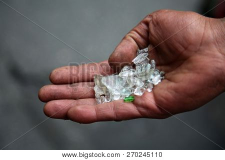 broken glass. an undeniable person tries to sell broken glass as Diamonds at $90.00 per carat to anyone they can in downtown Los Angeles California.  