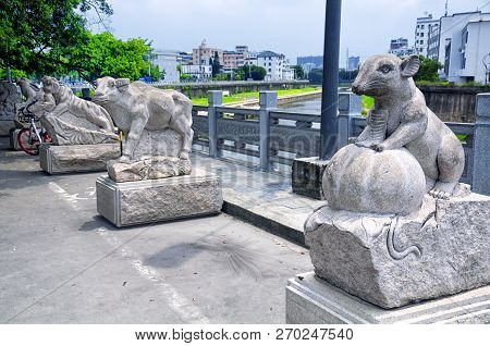 Chinese Zodiac Animal Statues Along A Water Canal In The Longhua District Of Shenzhen China.