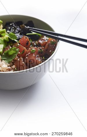 Tuna Poke With Avocado, Wild Rice And Seaweed. Hawaiian Traditional Food