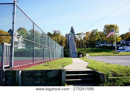 Pedestrians May Use An Iron Footbridge Over Us Highway 31, To Walk Safely Between The Residential Ar
