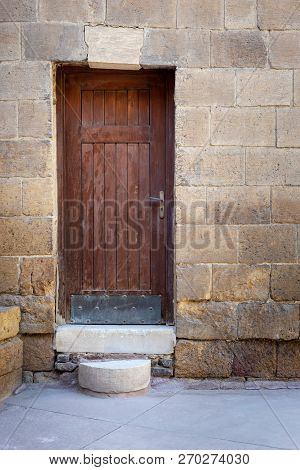 Old Wooden Door Framed By Bricks Stone Wall, Darb Al Ahmar District, Old Cairo, Egypt