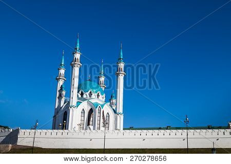 Minarets Of The Mosque Against The Blue Sky
