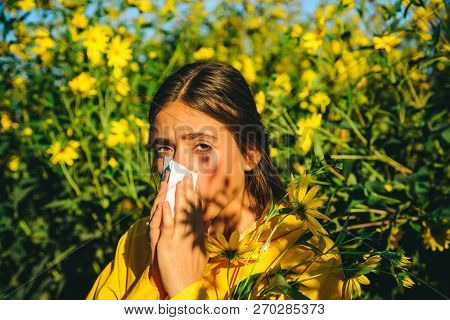 The Girl Suffers From Pollen Allergy During Flowering And Uses Napkins. Beautiful Sexy Young Woman L