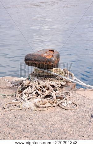 Photo Picture Of A Rusty Metal Mooring Bolard For Big Ship