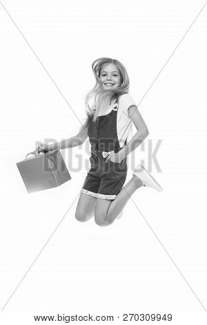 Finally Bought It. Girl Cute Teenager Carries Shopping Bag While Jumping. Sale Benefits. Kid Bought 
