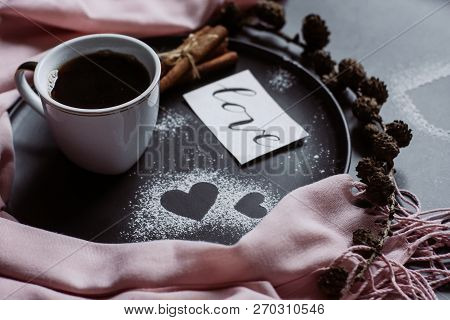 Valentines Day With Cup Of Coffee, Bumps,skarf, Cinnamon And Heart On Gray Table From Above In Flat 