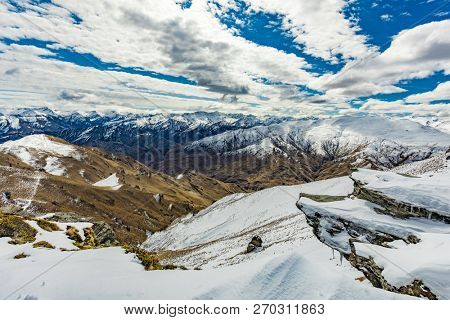 New Zealand mountain panorama and snow ski slopes as seen from Coronet Peak ski resort, Queenstown