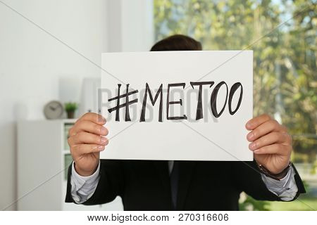 Man Holding Paper With Text 