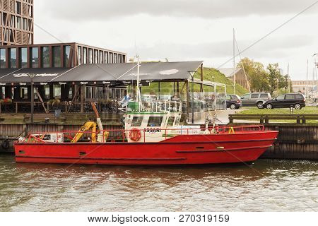 Klaipeda, Lithuania - September 22, 2018: Old Shabby Small Ship Near Embankment In The Center Of Kla