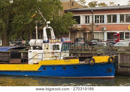 Klaipeda, Lithuania - September 22, 2018: Old Shabby Small Ship Near Embankment In The Center Of Kla