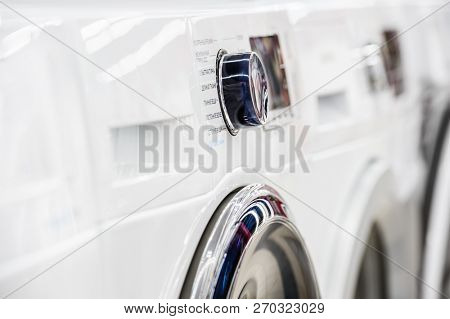 White washing mashine control panel closeup in appliance store
